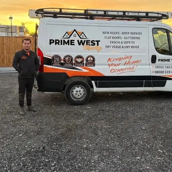 Michael Stokes, owner of Prime West Roofing, with the signwritten van